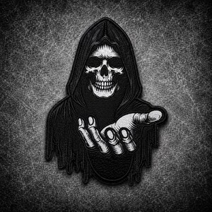 May include: A black and white embroidered patch featuring a hooded skeleton figure with a skull face. The figure is wearing a dark, tattered cloak and has one skeletal hand extended forward with the palm facing upward in a reaching gesture.