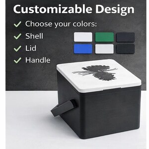 May include: A black cooler with a white lid featuring a black pinecone design. The cooler has a black handle and the text "Customizable Design" is visible. The image also shows color options for the shell, lid, and handle.