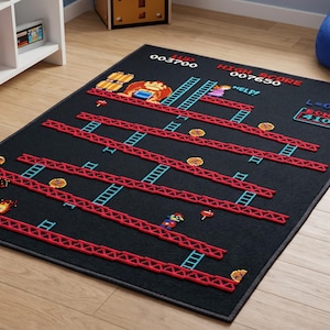 May include: Black rectangular rug with a pixelated design inspired by the classic arcade game, Donkey Kong. The rug shows the game's level layout with red girders, ladders, and characters. The rug also includes the game's score and level information.