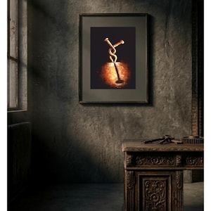 Peut inclure: Une impression d'art encadrée représentant deux clous entrelacés, avec une lumière chaude illuminant la base. L'œuvre est placée sur un fond sombre, créant un contraste saisissant. Le cadre est sombre, et l'esthétique générale est sombre.