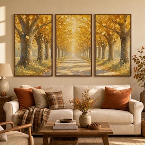 May include: A triptych wall art set featuring a perspective view of a tree-lined path during autumn. The paintings display tall trees with golden yellow foliage and fallen leaves covering the ground, framed in dark wood, creating a cohesive scene.