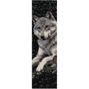 May include: A beaded pattern of a wolf sitting in a forest. The wolf is gray and white, and the forest is green and black.