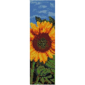 May include: A beaded sunflower with a yellow center, brown and green petals, and green leaves against a blue sky background.