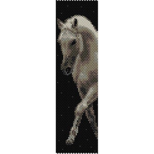 May include: A beaded pattern of a white horse on a black background. The horse is in profile and its head is turned to the side. The beads are arranged in a mosaic pattern to create the image.