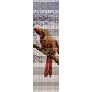 May include: A red cardinal bird perched on a branch with a snowy background. The bird has a brown head and a red body with a long tail.