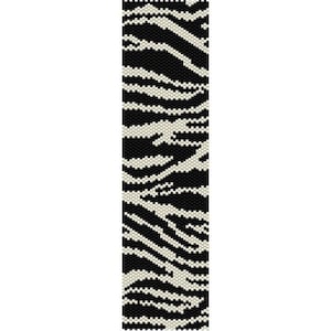 May include: Black and white beaded bracelet with a zebra stripe pattern.