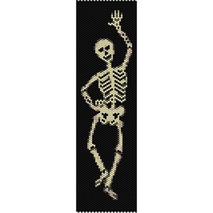 May include: A beaded skeleton figure with a black background. The skeleton is waving with one arm raised in the air.
