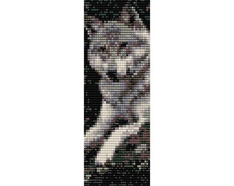 May include: A beaded pattern of a wolf with a gray and white fur pattern against a dark background.