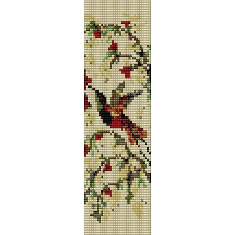 May include: A beaded pattern of a hummingbird in flight with red, orange, black, and green beads on a beige background.