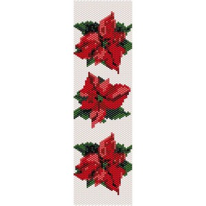 以下が含まれることがあります： 白い背景に、緑の葉が付いた赤いポインセチアの花が3つ、ビーズで模様が描かれている