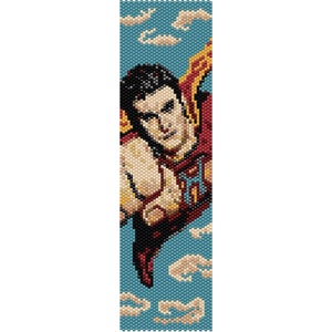 May include: A beaded pattern of a superhero flying through the air with a red, yellow, and blue cape. The background is a blue sky with white clouds.