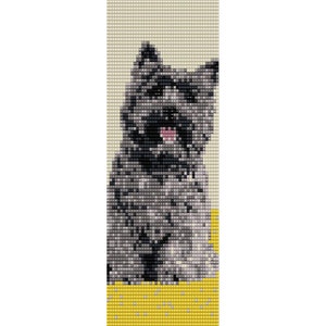 May include: A black and gray Cairn Terrier dog with a pink tongue sticking out sits on a yellow and white patterned background.