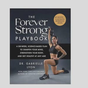 May include: The cover of "The Forever Strong Playbook" features a woman lifting a kettlebell. The book's title is in large white letters, with the subtitle "Playbook" below. Text on the cover includes "60 Recipes + Illustrated Workouts Inside" and a six-week plan.