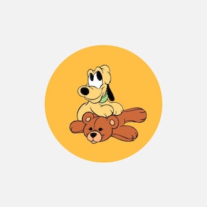 May include: A circular graphic featuring a yellow background with a light yellow cartoon dog wearing a green collar sitting on top of a brown teddy bear. The dog has large black eyes and a black nose, while the brown teddy bear has a stitched nose.