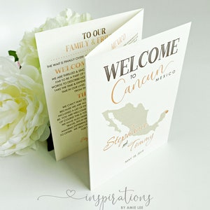May include: A welcome sign for a wedding in Cancun, Mexico. The sign is white with a brown outline and features a map of Mexico with a red dot marking Cancun. The text "Welcome to Cancun Mexico" is in brown with a gold outline. The names "Stephanie and Tommy" are written in gold script below the map. The date "May 18, 2019" is written in black below the names.