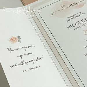 May include: Elegant wedding invitation with a floral design and the names Nicolette and Milo. The invitation features the quote "You are my sun, my moon, and all of my stars." by E.E. Cummings.
