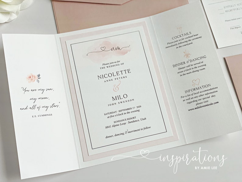May include: Wedding invitation with a soft pink and white design. The invitation includes the names Nicolette and Milo, the wedding date, and location. The text "You are my sun, my moon, and all of my stars" is also included.