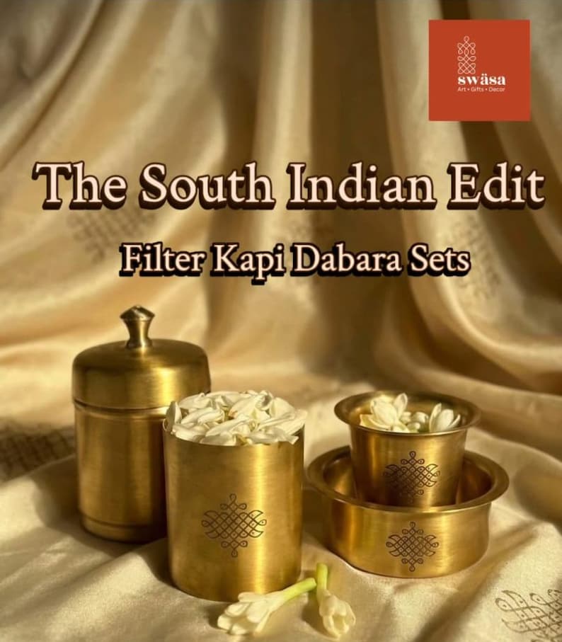 May include: A set of brass Filter Kapi Dabara vessels and a lidded container, each featuring a small engraved geometric motif. The text reads: The South Indian Edit Filter Kapi Dabara Sets and the logo sw&auml;sa Art Gifts Decor.