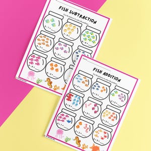 May include: Two white educational worksheets with pink borders titled Fish Subtraction and Fish Addition. Each page features multiple illustrations of fish bowls containing various colored fish and math equations to solve using the visual fish counts.