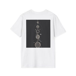 May include: White t-shirt featuring a dark gray square graphic on the back. The graphic depicts a line of planets and celestial bodies in a minimalist, line-art style. The design includes planets, rings, and stars.