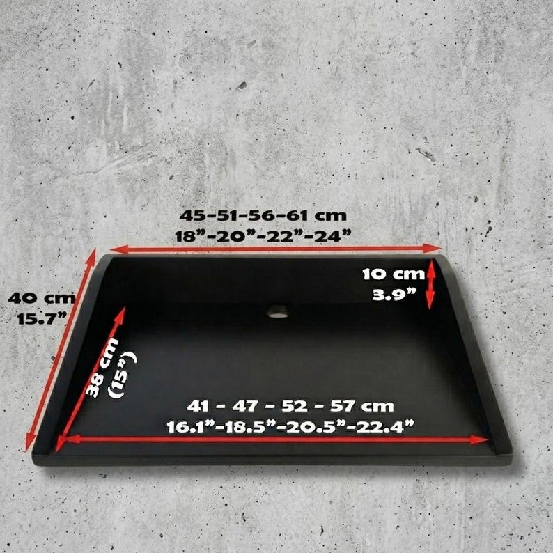 May include: A black rectangular object with rounded edges, featuring dimensions in inches and centimeters. The object is 15.7 inches (40 cm) high, 15 inches (38 cm) deep, and 3.9 inches (10 cm) wide. The width ranges from 16.1 to 22.4 inches (41-57 cm).