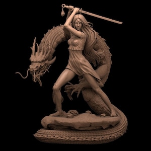 May include: A detailed sculpture of a woman with long flowing hair, holding a sword above her head, standing on a rock with a dragon behind her. The dragon is intricately detailed with horns and scales. The sculpture is a neutral brown color against a black background.