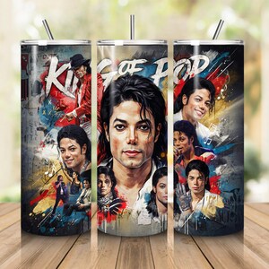 May include: A cylindrical stainless steel tumbler with a straw, featuring a collage of Michael Jackson portraits in various outfits and poses. The design includes the text King of Pop in a bold white font against a colorful, abstract background.