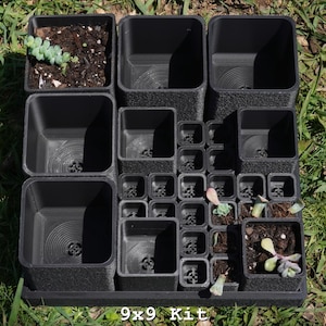 May include: A black 9x9 kit for succulents and small plants. The kit includes various sized square pots, some containing small succulents. The pots are arranged in a grid pattern on a tray, set against a backdrop of green grass.