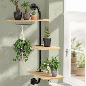 May include: A three-tiered, black metal and wood plant shelf with various potted plants. The shelf is mounted on a wall with floral wallpaper. A hanging plant in a macrame holder is suspended from the middle shelf.