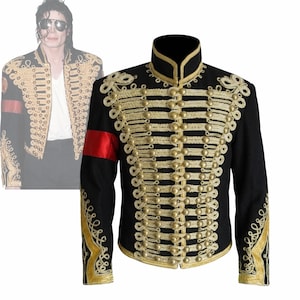 May include: Black military-style jacket with gold embroidery and buttons. Features a high collar and a red armband. The jacket has intricate gold detailing along the front, sleeves, and shoulders, creating a striking visual contrast.