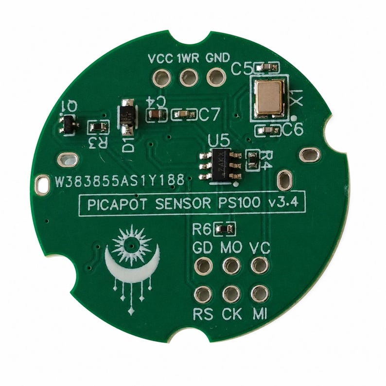 May include: A circular green printed circuit board labeled PICAPOT SENSOR PS100 v3.4 with the serial number W383855AS1Y188. The board features various electronic components, including a central chip, a crystal oscillator, and a white sun and moon graphic.