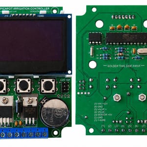 May include: A green printed circuit board irrigation controller with a dark display screen, three black push buttons, a 3A fuse, a CR2032 battery, and a blue terminal block. The board features text including PICAPOT IRRIGATION CONTROLLER.