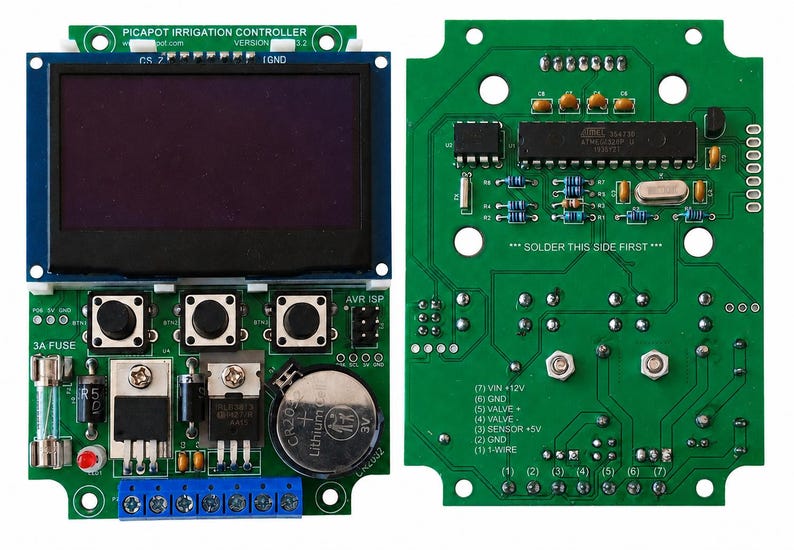 May include: A green printed circuit board irrigation controller with a dark display screen, three black push buttons, a 3A fuse, a CR2032 battery, and a blue terminal block. The board features text including PICAPOT IRRIGATION CONTROLLER.