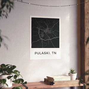 May include: A black and white map print of Pulaski, TN, displayed on a white background. The map features detailed road and street layouts. The text "PULASKI, TN" is printed in a clean, modern font below the map.