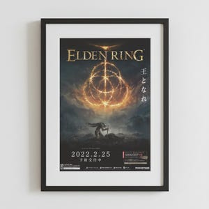 May include: Framed poster for the video game Elden Ring. The poster features the game's logo in gold, a central glowing symbol, and a figure with a sword. The date 2022.2.25 is displayed prominently.