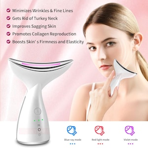 May include: A white beauty device with a curved head and a rounded base. The device has a pink light and green indicator lights. Text on the image includes "Minimizes Wrinkles & Fine Lines" and "Blue-ray mode".