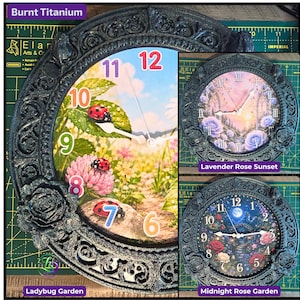 May include: Three round wall clocks with ornate, dark, textured frames featuring rose accents. The Ladybug Garden clock displays a garden scene with ladybugs and colorful numbers. The Lavender Rose Sunset clock shows a floral landscape with Roman numerals. The Midnight Rose Garden clock features a night garden scene with Arabic numerals.