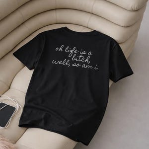 May include: A set of three ceramic mugs with a speckled, matte finish. The mugs are in shades of cream, light gray, and dark gray. Each mug has a simple, minimalist design, perfect for coffee or tea.