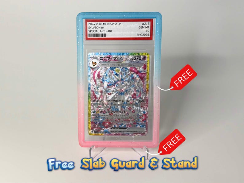 May include: A 2024 Pokemon SV8a JP Sylveon ex #212 Gem Mt 10 trading card in a protective slab. The slab features a blue-to-pink gradient frame with glitter accents. The card displays Japanese text and a holographic illustration of the character.