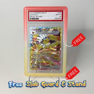 May include: A graded Jolteon ex trading card in a protective plastic slab with a pink and yellow gradient border. The card features Japanese text and artwork of the character. The slab is displayed on a clear plastic stand, and two red tags are attached.