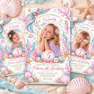 May include: A rectangular birthday invitation card featuring a central arch frame containing a photograph of a child. The design includes watercolor illustrations of pink coral, blue seaweed, seashells, a seahorse, and a mermaid tail with text.