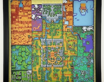 May include: A square, multi-layered wall art piece featuring a detailed, top-down pixel art map of a fantasy landscape. The map is divided into distinct colored regions including orange deserts, green forests, blue water, and gray stone structures.