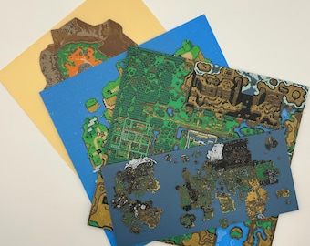 May include: A collection of colorful map prints, featuring detailed illustrations of landscapes with green forests, blue waters, and brown mountains. The maps are layered on top of each other, with a yellow background.