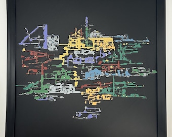May include: A square black frame containing a multi-layered, abstract map-like composition. The artwork features intricate, interconnected shapes in shades of yellow, green, red, blue, and purple, set against a solid black background.