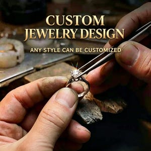 May include: A close-up of a jeweler's hands working on a diamond ring. The ring is held with tweezers, and the text "CUSTOM JEWELRY DESIGN" and "ANY STYLE CAN BE CUSTOMIZED" are displayed in gold lettering.