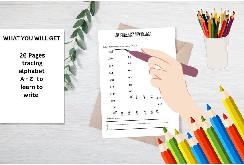 May include: An educational image featuring a white paper with the text "ALPHABET BOOKLET" and a hand tracing the letter "J". The text "WHAT YOU WILL GET" and "26 Pages tracing alphabet A-Z to learn to write" are also visible. A cup of colored pencils and other pencils are also present.