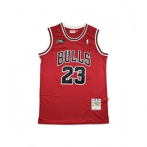 May include: Red basketball jersey with white and black accents. The jersey features the word "BULLS" in white block letters and the number "23" in black. A small NBA Finals patch is visible.