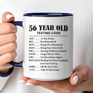 May include: A set of three ceramic mugs with a speckled, matte finish. The mugs are in shades of cream, light gray, and dark gray. Each mug has a simple, minimalist design, perfect for coffee or tea.