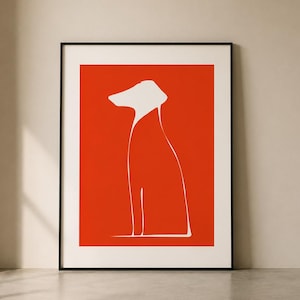 Op de afbeelding: Een ingelijste kunstdruk met een minimalistische hondenillustratie. Het kunstwerk toont een witte omtrek van een hond tegen een feloranje achtergrond. De print is ingelijst in een zwarte lijst, ideaal voor interieurdecoratie.