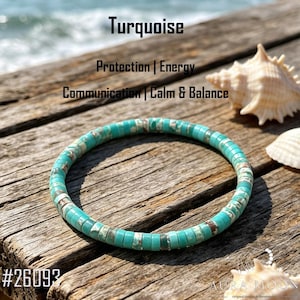 May include: A circular bracelet made of small, flat, turquoise-colored disc beads with brown and white marbling. The text on the image reads: Turquoise, Protection | Energy, Communication | Calm & Balance, and the number #26093.